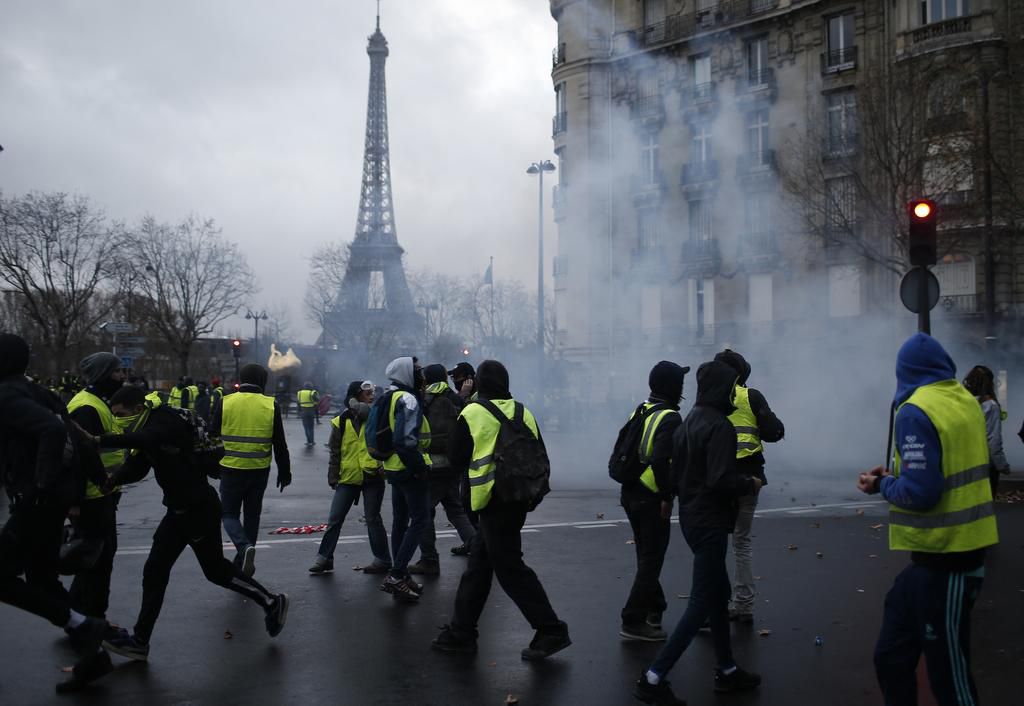 More than 1,300 were arrested and dozens injured after violent anti-government protests engulfed France — here's how the clashes unfolded
