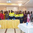 Newmont and Project C.U.R.E officials with health professionals.