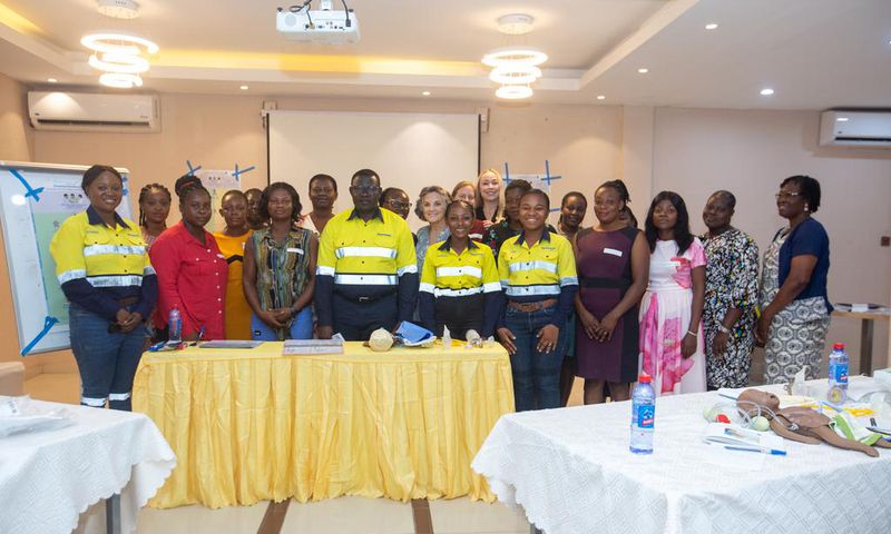 Newmont and Project C.U.R.E officials with health professionals.
