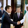Nigeria’s President Muhammadu Buhari greets China’s Foreign Minister Wang Yi (C) and Chinese Ambassador to Nigeria Zhou Pingjian during their visit to the Presidential Villa in Abuja, Nigeria [REUTERS]