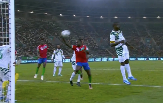Muhammed Sanneh trying to score with his hand.