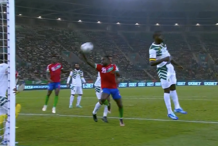 Muhammed Sanneh trying to score with his hand.