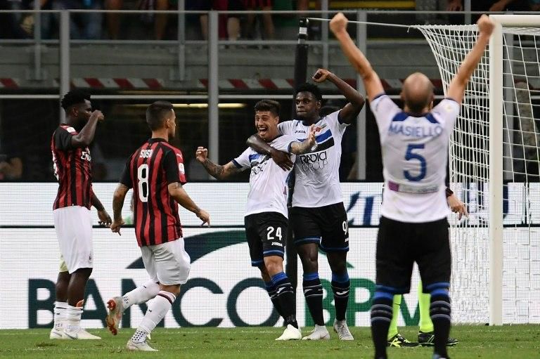 Emiliano Rigoni snatched a point as Atalanta came from behind twice to hold AC Milan 2-2 at the San Siro.