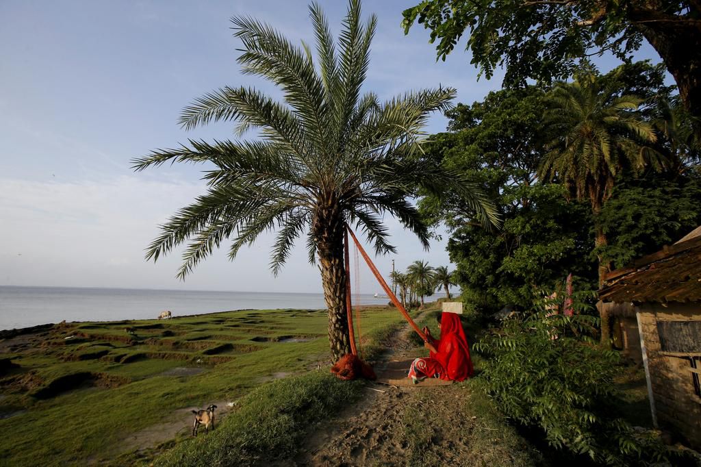 An island in India is disappearing, but some of the last residents say they can't afford to move away