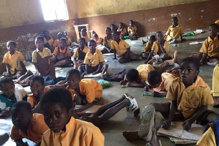 Pupils sit on bare floor (File photo)