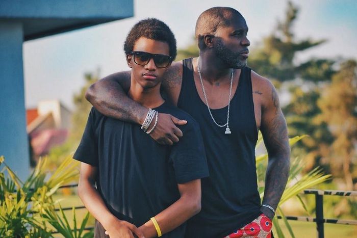 A father and his teenage son posing on a balcony [Photo: Kaysha]