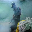 A member of the Cuban army fumigates against the Aedes aegypti mosquito to prevent the spread of Zika, chikungunya and dengue, in Havana, on February 23, 2016