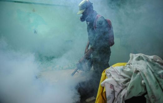 A member of the Cuban army fumigates against the Aedes aegypti mosquito to prevent the spread of Zika, chikungunya and dengue, in Havana, on February 23, 2016