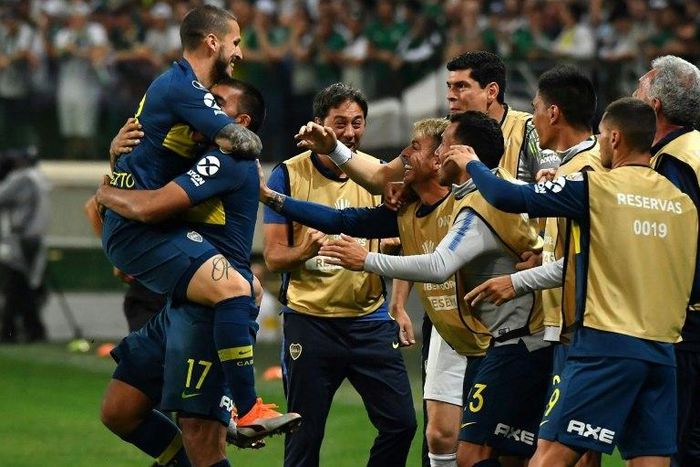 Dario Benedetto (left) celebrates scoring a goal against Palmeiras that helped Boca Juniors secure their Copa Libertadores final spot against bitter rivals River Plate
