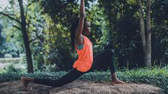 A woman showcasing a yoga pose outdoors [Photo: Oluremi Adebayo]