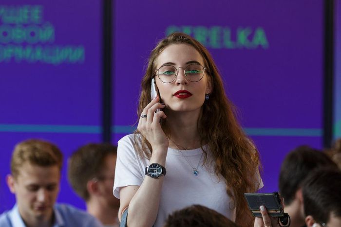 millennial on phone woman phone