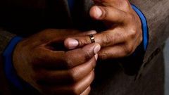 Man taking off wedding ring