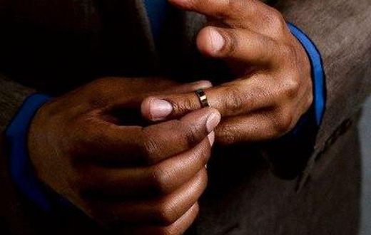 Man taking off wedding ring