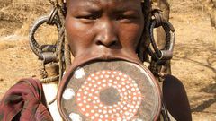 Why girls of the Mursi tribe must remove their teeth and stretch their lips before they marry