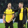 Borussia Dortmund midfielders Thomas Delaney (L), Jacob Bruun Larsen (C) and Marco Reus (R) celebrate Saturday's 1-0 win at Wolfsburg - a new club record of 15 games unbeaten - ahead of Tuesday's tough Champions League game away to Atletico Madrid.