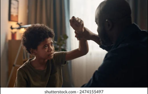 Father beating son [Shutterstock]
