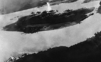 Believed to be the first bomb dropped on Pearl Harbor, Hawaii in the sneak-attack on Dec. 7, 1941, this picture was found torn to pieces at Yokusuka Base by photographer's mate 2/C Martin J. Shemanski of Plymouth, Pa. One Japanese plane is shown pullin...