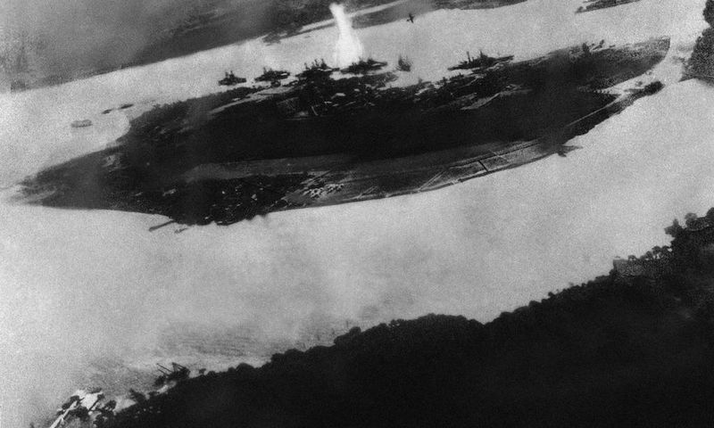 Believed to be the first bomb dropped on Pearl Harbor, Hawaii in the sneak-attack on Dec. 7, 1941, this picture was found torn to pieces at Yokusuka Base by photographer's mate 2/C Martin J. Shemanski of Plymouth, Pa. One Japanese plane is shown pullin...