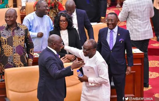 Vice president of Ghana, Dr. Bawumia & Finance Minister Ken Ofori-Atta hug on floor of parliament