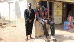Awuche now lives with his older brother (L) in Gambaga