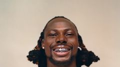 Asake has an unmistakable tattoo of his name on his neck [GQ Magazine]