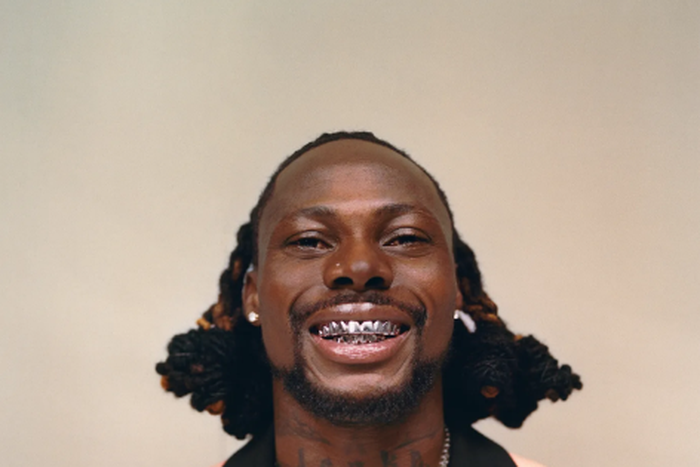 Asake has an unmistakable tattoo of his name on his neck [GQ Magazine]