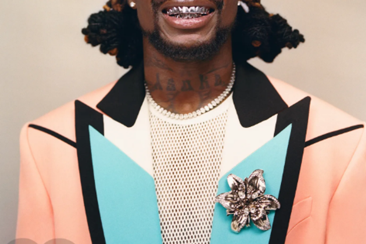 Asake has an unmistakable tattoo of his name on his neck [GQ Magazine]
