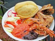 Ga kenkey with sauce and fried fish