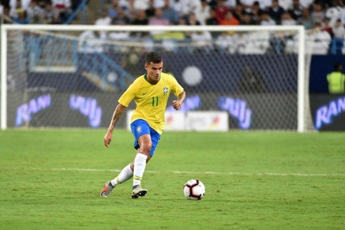 Brazil midfielder Philippe Coutinho, playing here against Saudi Arabia last month, is one of three players to drop out of Tite's squad through injury