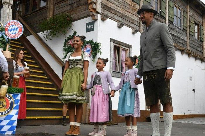 Bayern Munich defender Jerome Boateng with his family on a visit to the Munich beer festival