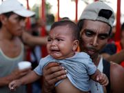 Powerful photos and stories from the caravan show migrants' harrowing journey to the US