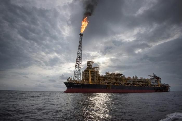 The "Kaombo Norte" is a vast oil-extraction vessel, moored off the coast of Angola