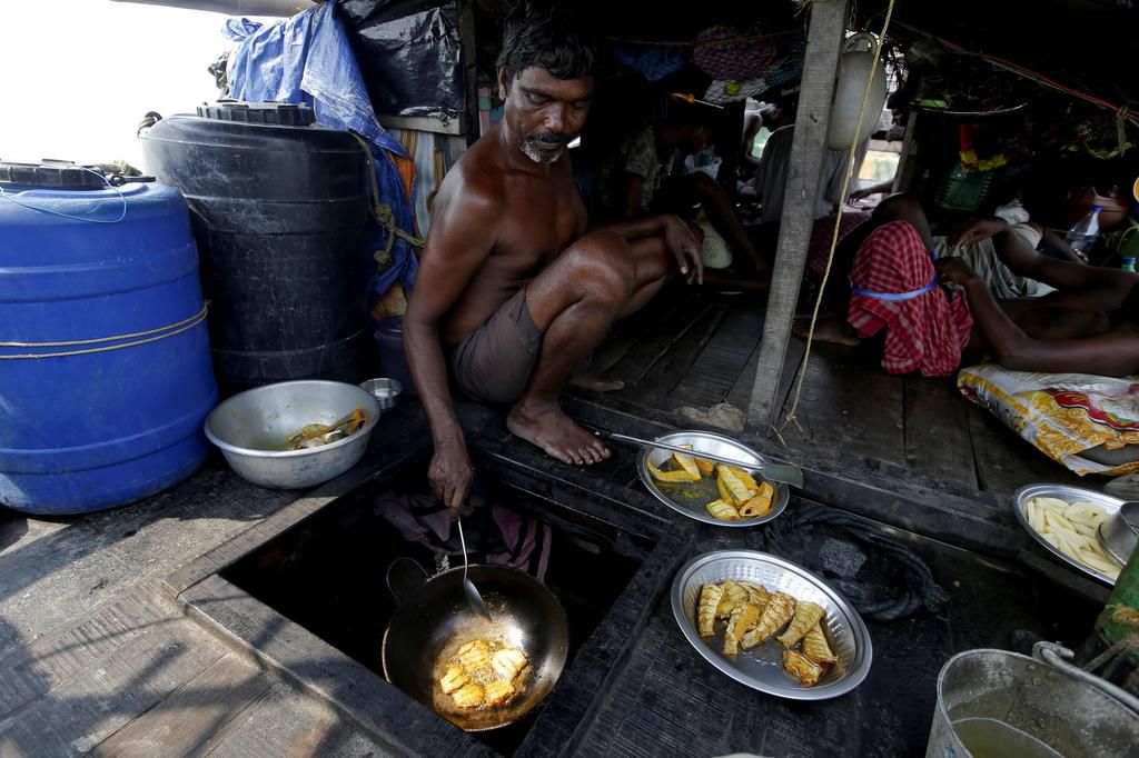 An island in India is disappearing, but some of the last residents say they can't afford to move away