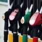 A row of fuel pumps of a fuel distributor at Shell gas station.