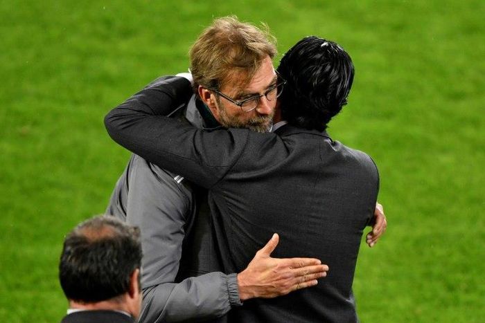 Unai Emery (right) embraces Jurgen Klopp at the end of the 2016 Europa League final