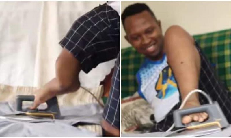 Sammy Brayo, born without arms demonstrates how he irons his clothes