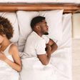 Frustrated Black couple in bed [iStock]