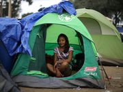 Powerful photos and stories from the caravan show migrants' harrowing journey to the US