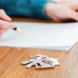 A stock photo shows a person signing a mortgage contract.Getty Images