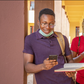 Students pressing their phones [Techpoint Africa]
