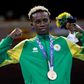 Samuel Takyi receives his bronze medal