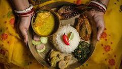 Offering food with both hands in India [crossbordermagazines]