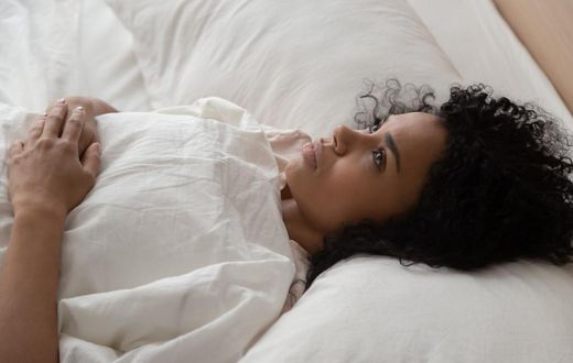 woman lying in bed
