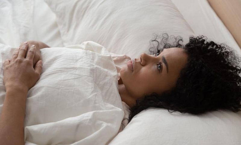 woman lying in bed