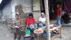 Tanazania n woman cooking and selling bereal