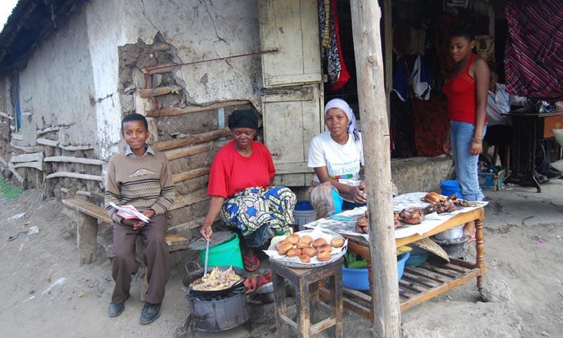 Tanazania n woman cooking and selling bereal