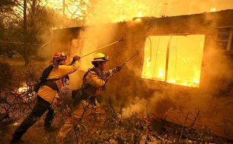camp fire battling the flames
