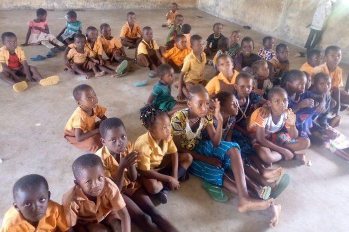 Pupils study on bare floor