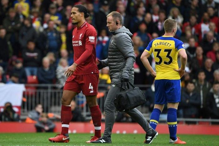 Liverpool's Virgil van Dijk is a doubt for Saturday's trip to Chelsea