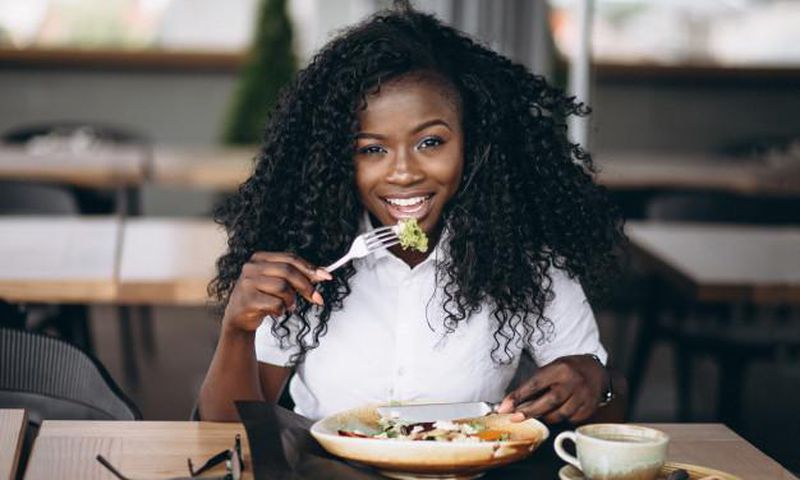 Lady eating food for good mood